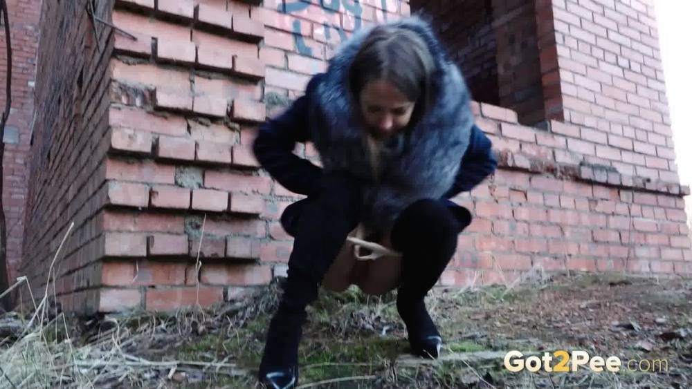 Distressed girl Nastya pulls down her tights to pee by an abandoned building - #6