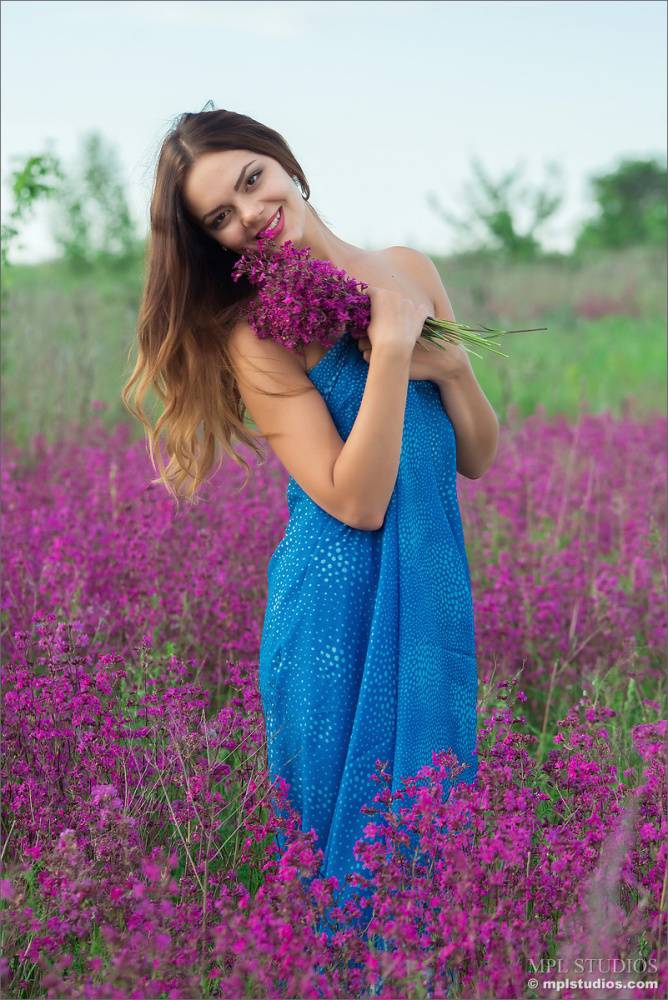 Glamour girl strikes hot nude poses in a field filled with wild flowers - #8