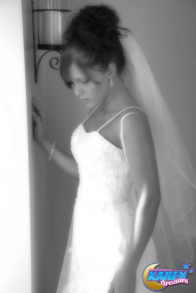 Amateur model Karen poses in wedding dress during solo action | Photo: 381052
