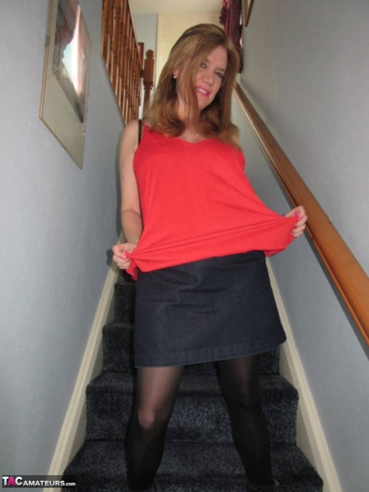 Foxy MILF Lily May displays her big booty and spreads pussy on the stairs - #2