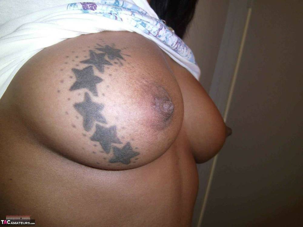 Ebony amateur takes self shots of her big tattooed boobs and bald vagina - #13
