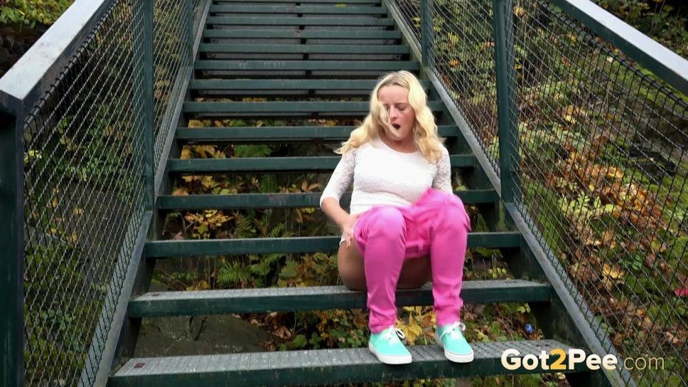 Blonde Victoria Pure pulling down her tight pants to pee on the bleachers - #5