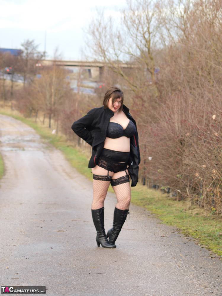 Overweight woman Roxy exposes herself while walking a path in black boots - #6