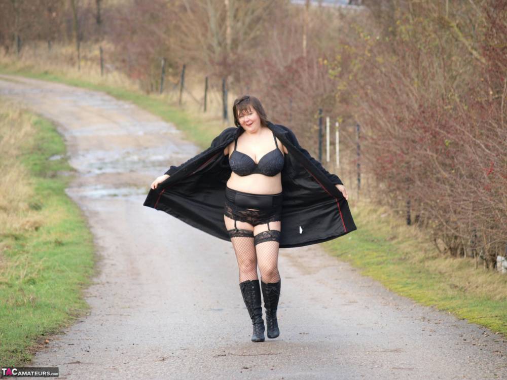 Overweight woman Roxy exposes herself while walking a path in black boots - #4