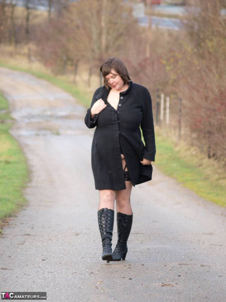 Overweight woman Roxy exposes herself while walking a path in black boots - #5