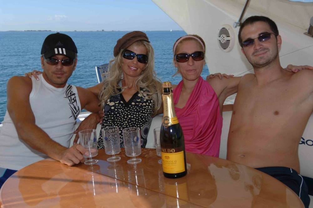 A bottle of downed wine leads to group sex action atop a boat at sea - #1