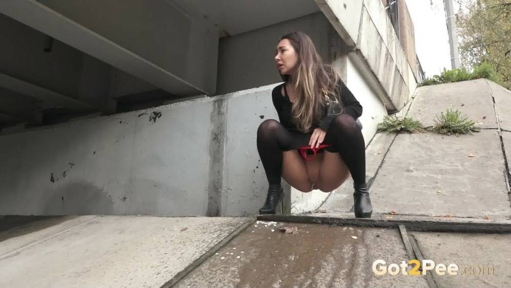 Distressed girl Sasha S pulls down her hose to pee underneath a bridge - #6