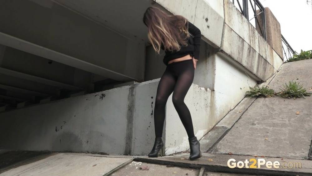 Distressed girl Sasha S pulls down her hose to pee underneath a bridge - #7