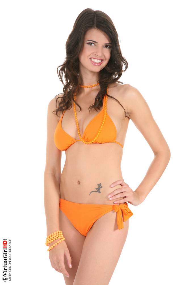 Beautiful girl with long legs Jasmine Andreas takes off her bikini - #11