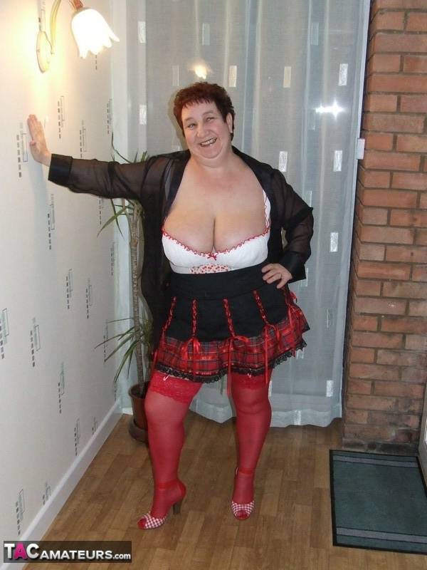 Fat amateur with short hair Kinky Carol exposes her huge tits in red nylons - #14