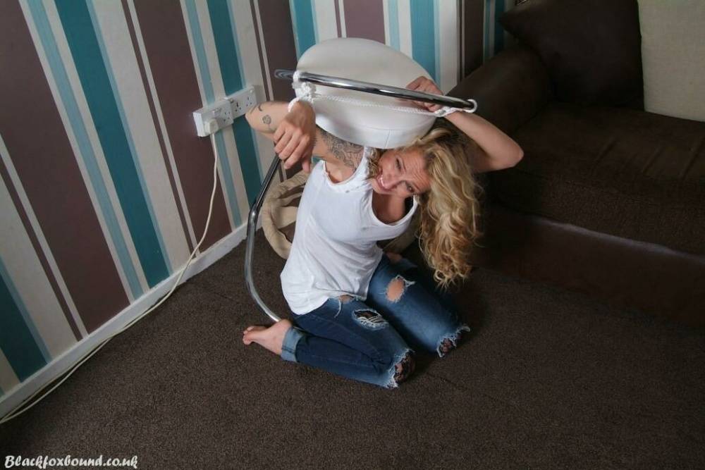 Fully clothed blonde Katie C struggles while restrained with rope bindings - #12