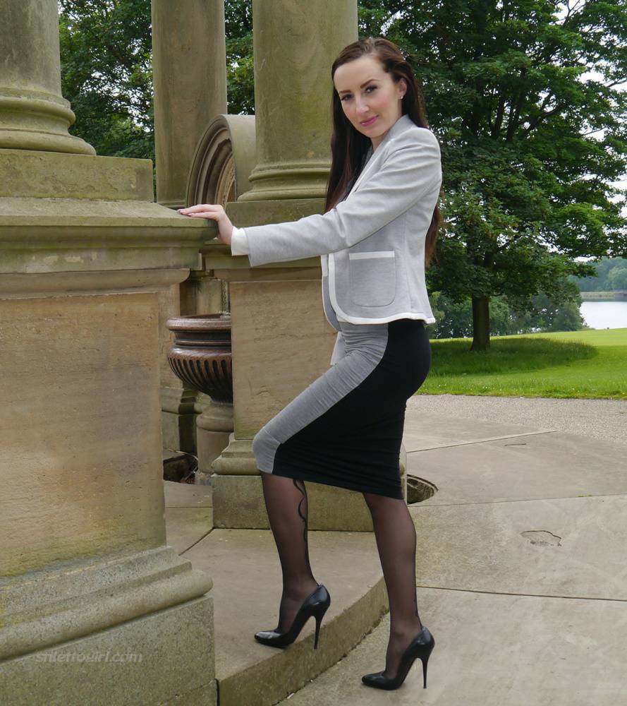 Clothed woman Sophia descends park steps in a long skirt and stiletto heels - #15