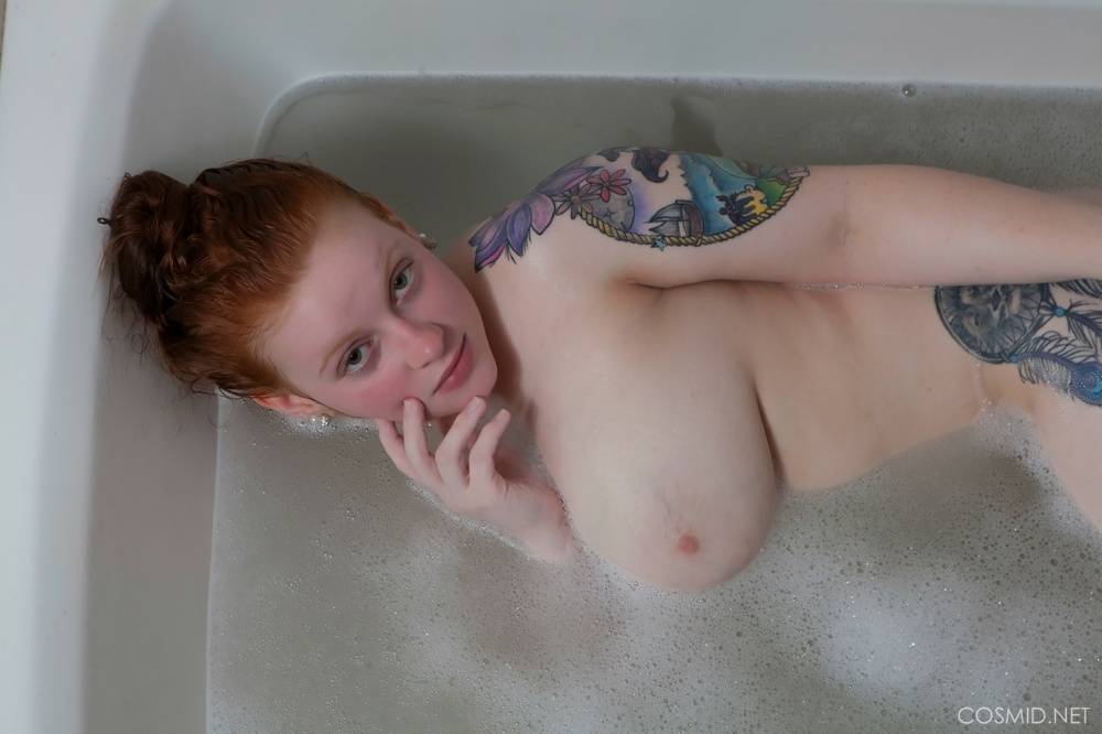 Pale redhead Kaycee Barnes displays her large boobs and butt during a bath - #4