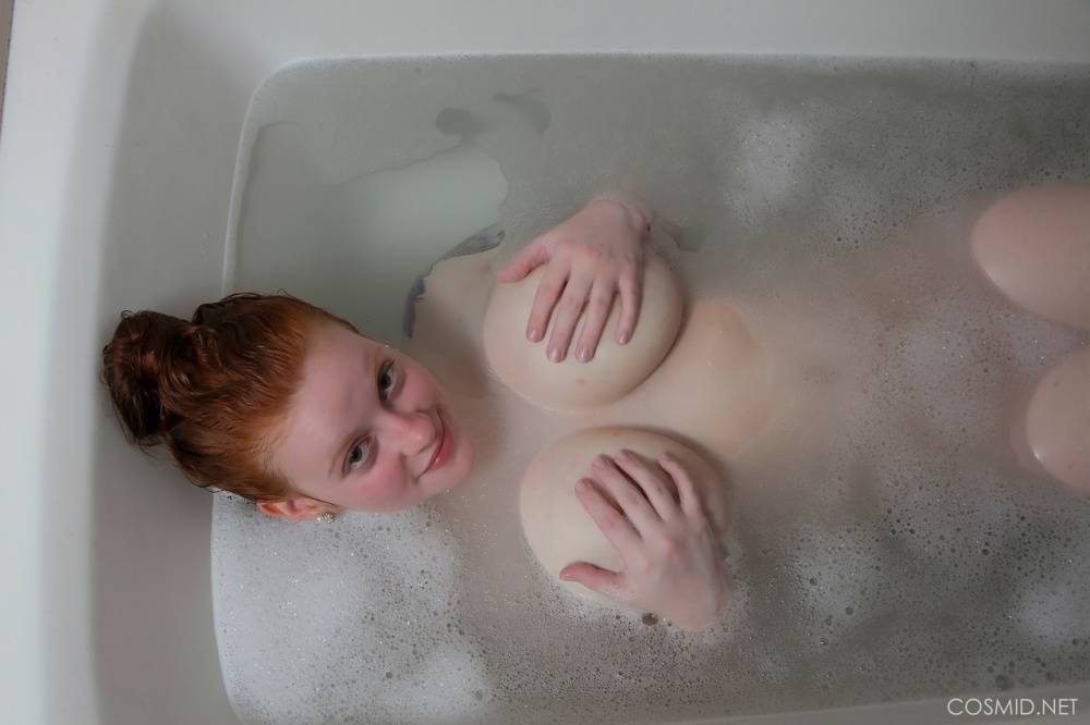 Pale redhead Kaycee Barnes displays her large boobs and butt during a bath - #7