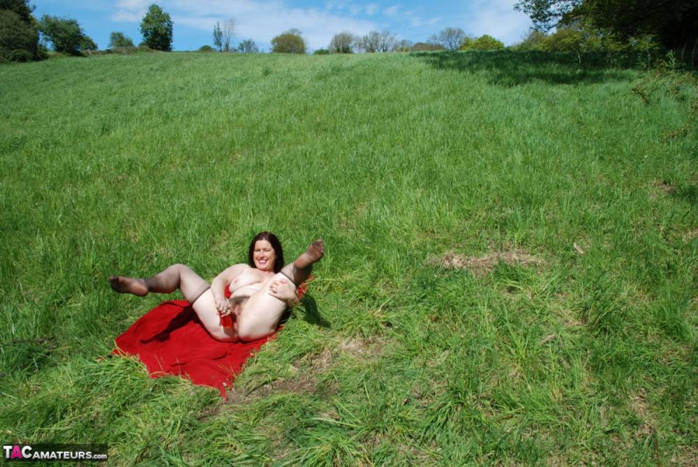 British amateur Juicey Janey dildos her bush on a red blanket in a field - #5