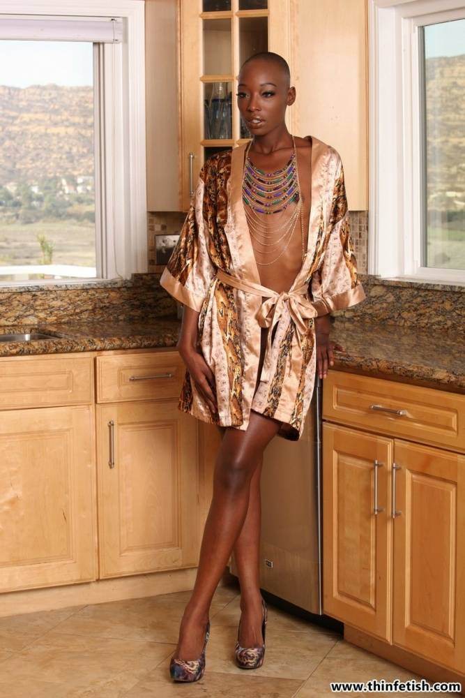 Long legged ebony model Taylor Starr sports a shaved head while getting naked - #15
