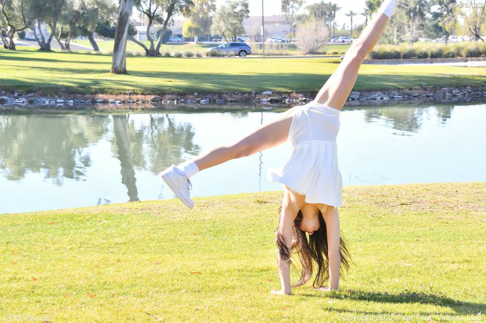 Brunette amateur Dakota does a cartwheel in a park before getting naked - #11