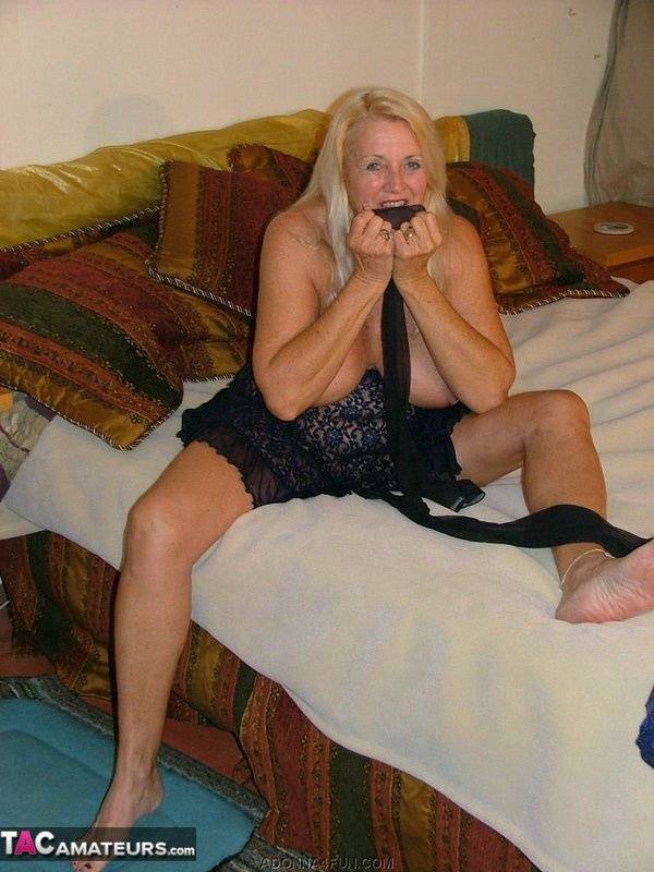 Blonde granny Adonna removes her stockings before stuffing them in her pussy - #8