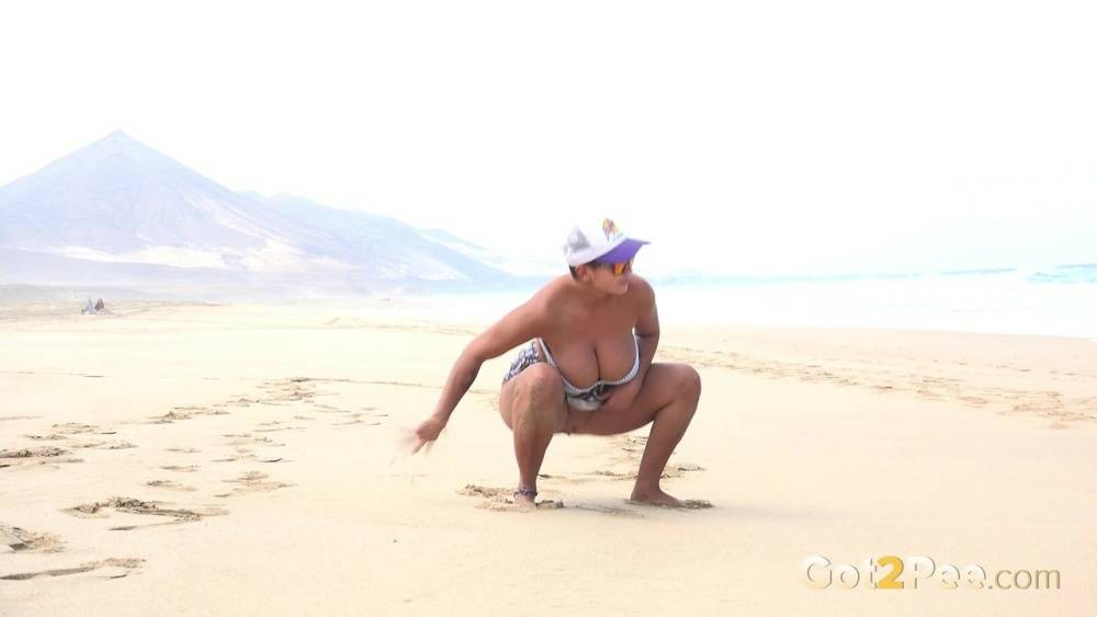 Caucasian female Chloe takes a piss while while traipsing on a deserted beach - #2
