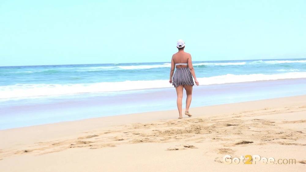 Caucasian female Chloe takes a piss while while traipsing on a deserted beach - #5