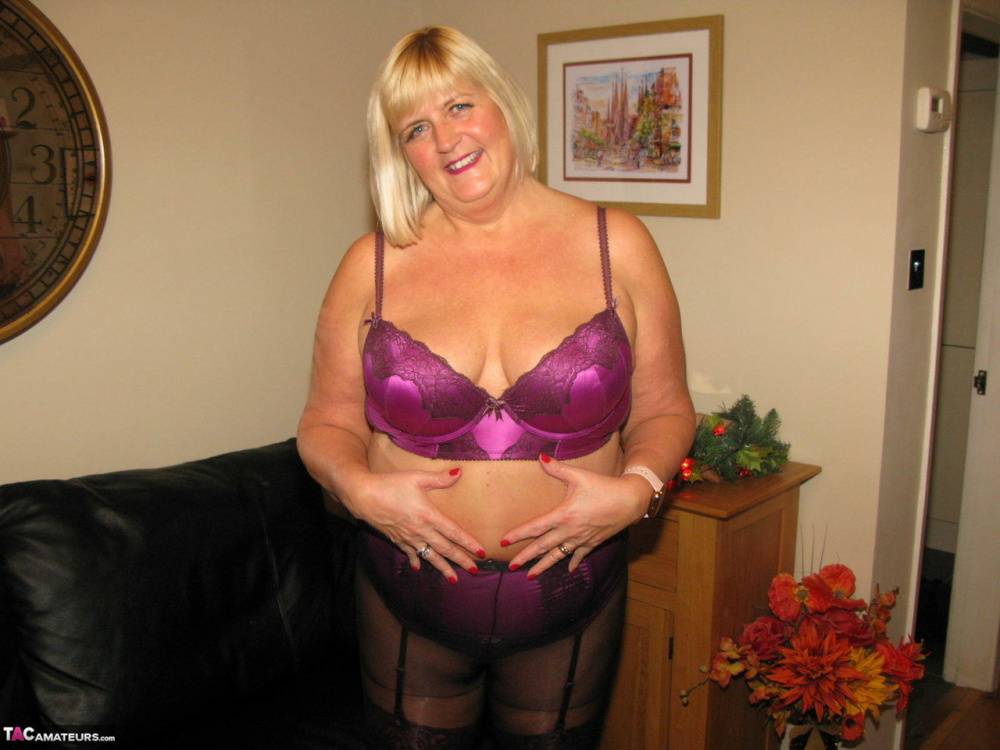 Mature blonde BBW Chrissy Uk goes topless before ripping open her pantyhose - #13