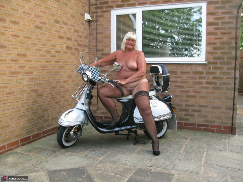Overweight blonde Chrissy Uk strips down to her stockings next to her scooter - #11