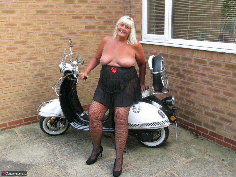 Overweight blonde Chrissy Uk strips down to her stockings next to her scooter - #3