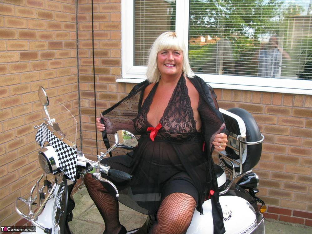 Overweight blonde Chrissy Uk strips down to her stockings next to her scooter - #5