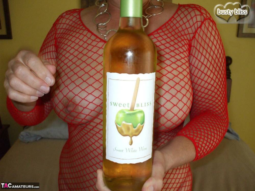 Mature amateur Busty Bliss gives a blowjob while drinking a bottle of wine - #16