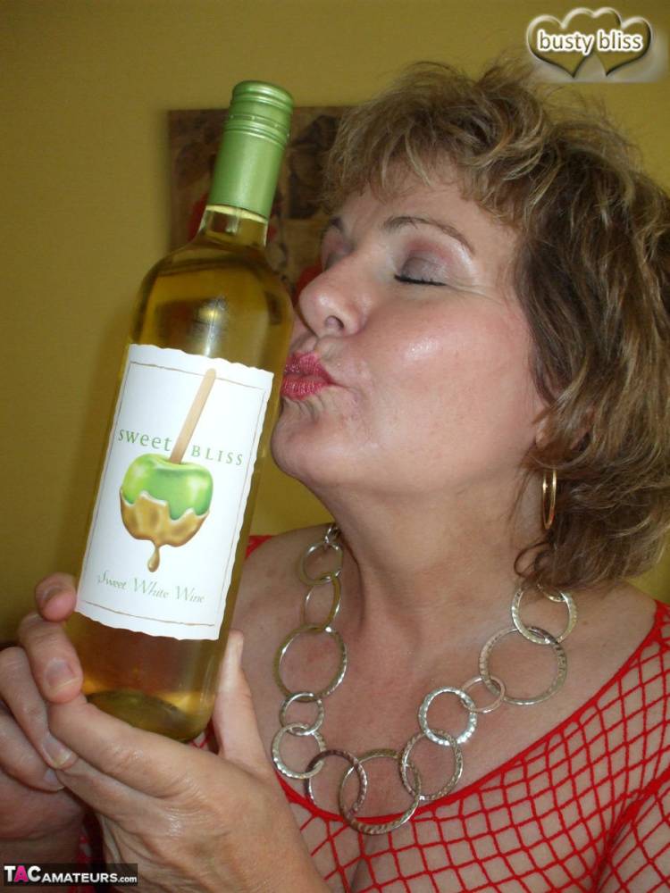 Mature amateur Busty Bliss gives a blowjob while drinking a bottle of wine - #4