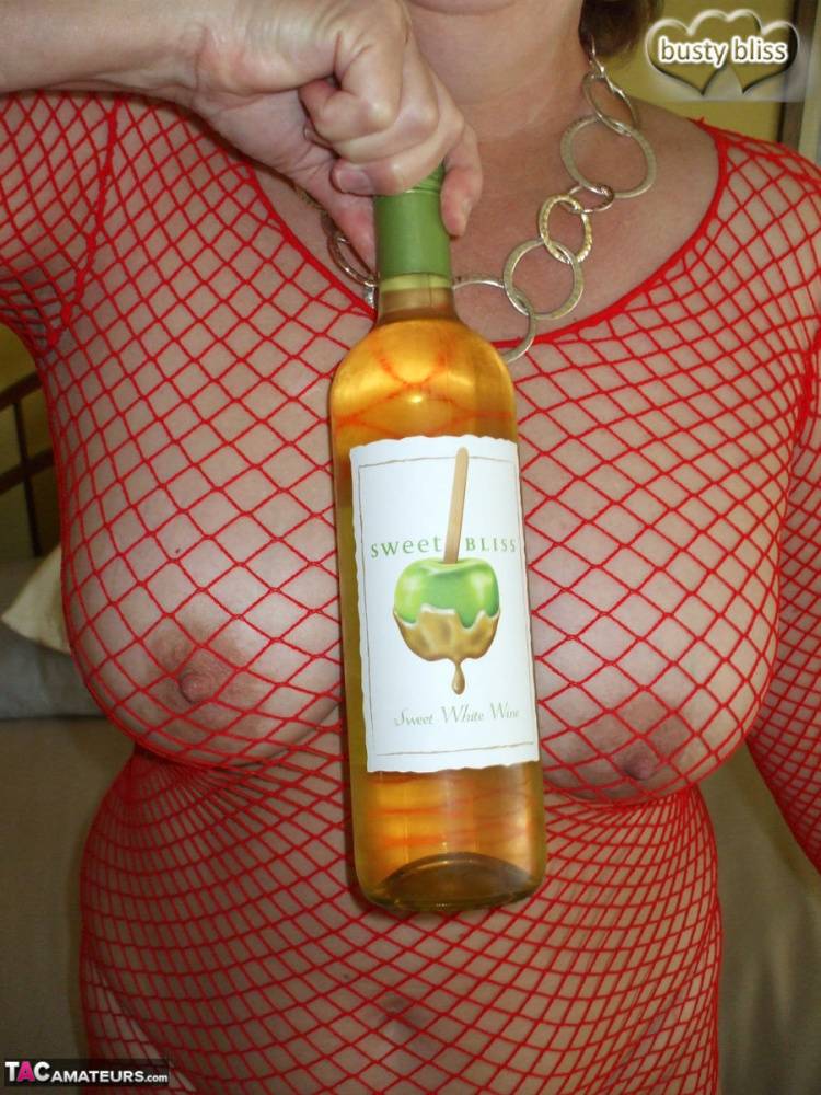 Mature amateur Busty Bliss gives a blowjob while drinking a bottle of wine - #10
