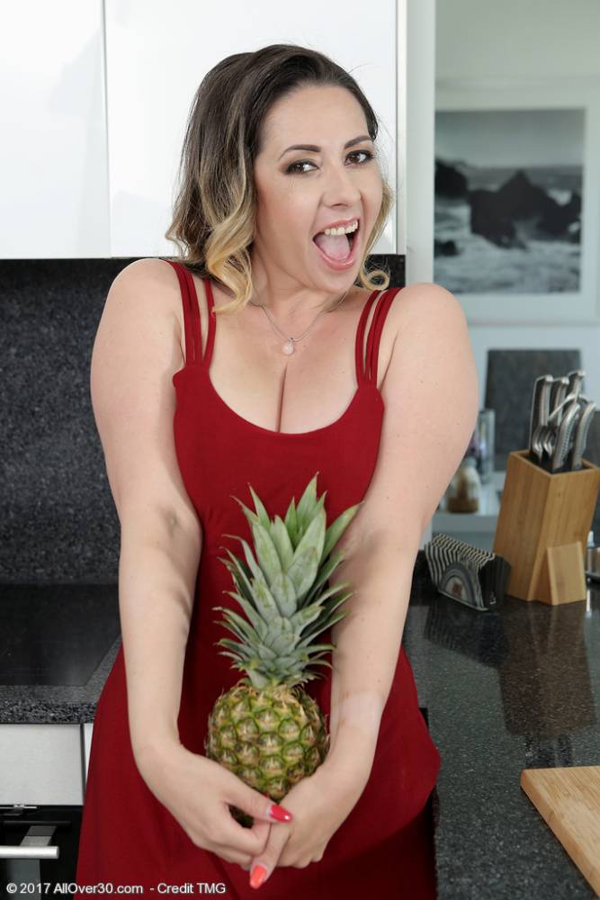30 plus female Daria Glower eats a pineapple while getting naked in a kitchen - #3