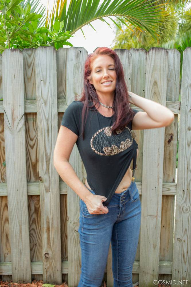 Hot redhead Andy Adams loses her t-shirt & jeans in the yard to pose naked - #7