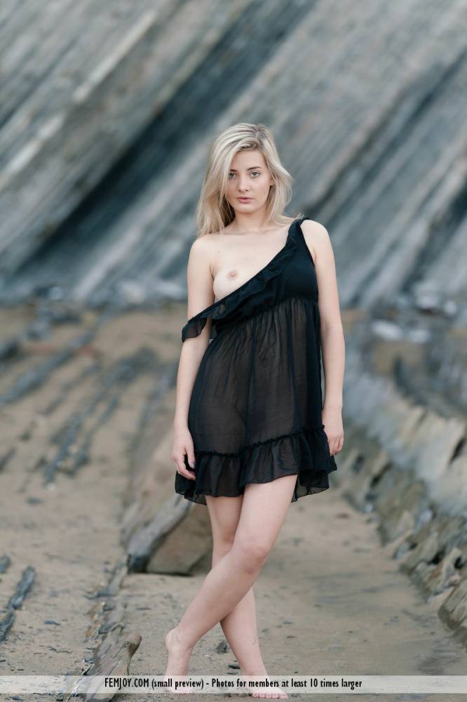Young blonde Anna T removes black lingerie for a nude shoot at low tide - #7