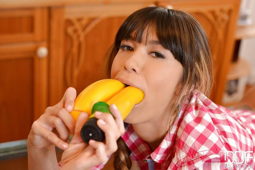 Hot European teenager Mona Kim eating a banana in a most sexy manner - #12