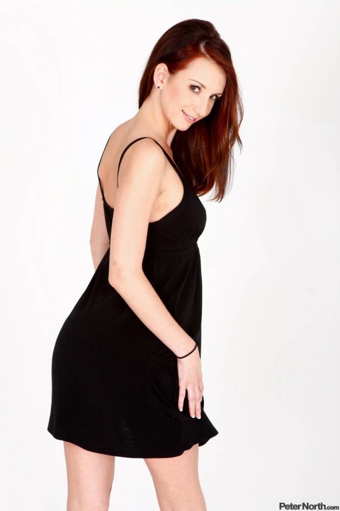 Pale redhead Katie Jordan hitches a black dress up and over her bare ass | Photo: 883681