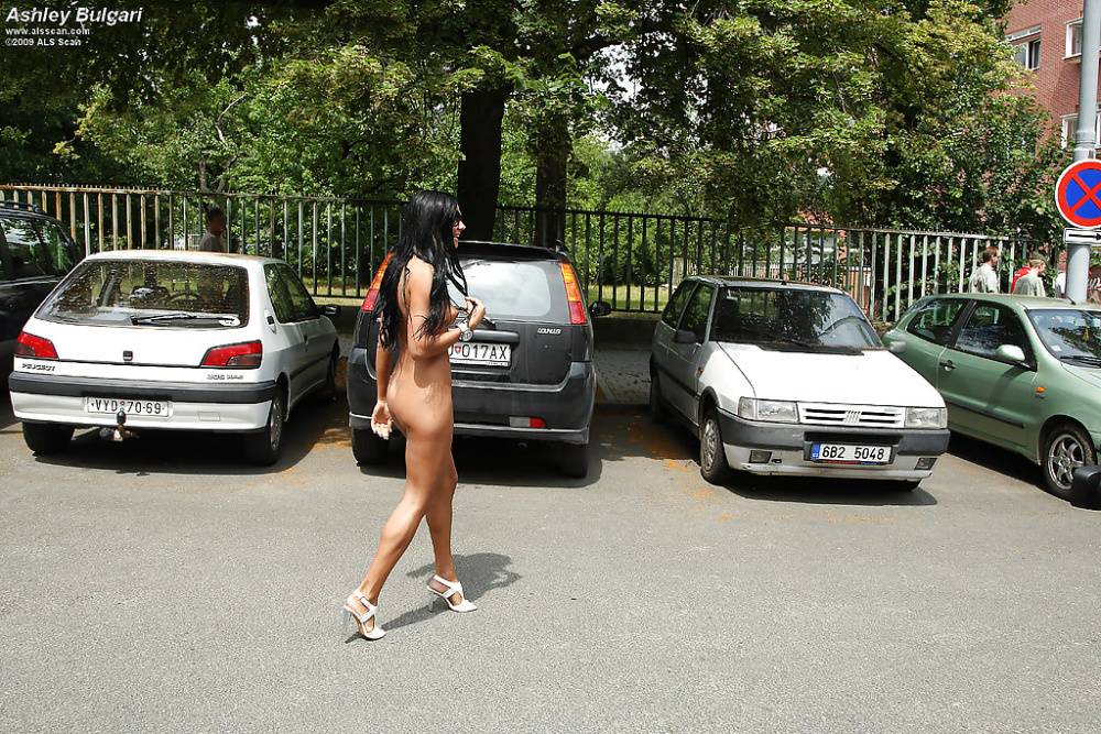 Pretty teenage brunette in sunglasses posing naked in public places - #10
