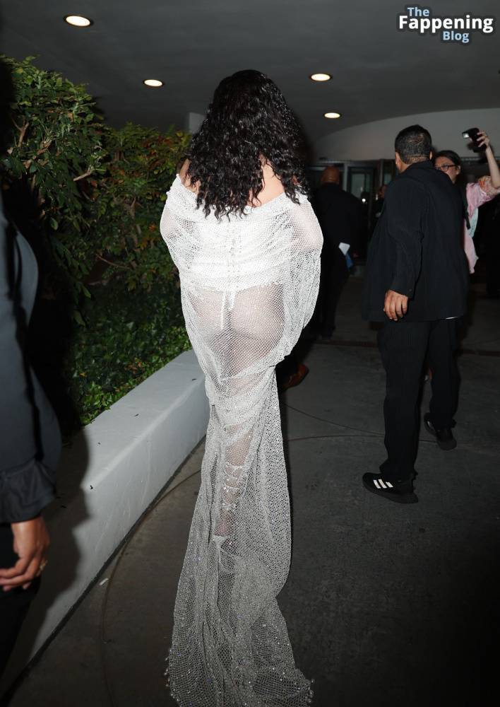 Rihanna Displays Her Curves in a White Dress (13 Photos) - #13