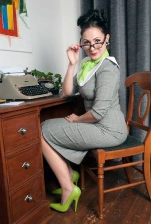MILF secretary Sophie Delane in glasses stripping to spread naked at her desk | Photo: 22945