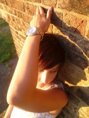 Girl next-door type Roxy shows off her new watch while outside her home - #main