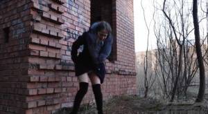 Distressed girl Nastya pulls down her tights to pee by an abandoned building on realgirlsweb.com