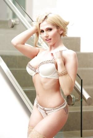 Skinny blonde pornstar Christie Stevens modelling in bra and panty set on realgirlsweb.com