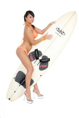 Sexy surfer girl Sarah peels off her bikini to model naked on her board on realgirlsweb.com