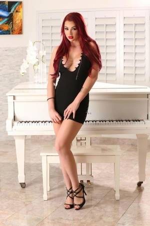 Hot redhead Skyla Novea sucks and tit fucks her man's long cock on realgirlsweb.com