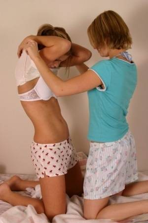 Young amateur Karen & Amy enjoy undressing each other & kissing in underwear on realgirlsweb.com