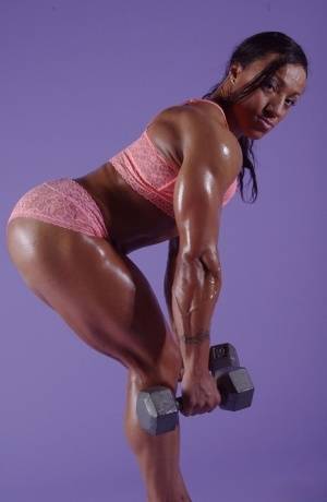 Black bodybuilder Karen Garrett displays her muscled physique on realgirlsweb.com