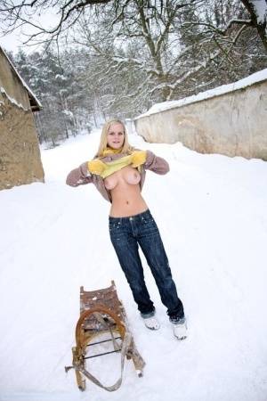 Busty blonde bares big tits in the snow & sucks POV for mouthful of cum on realgirlsweb.com