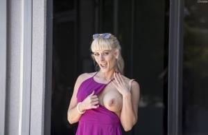 Naughty blonde flashes no panty upskirts and her big tits out in public on realgirlsweb.com