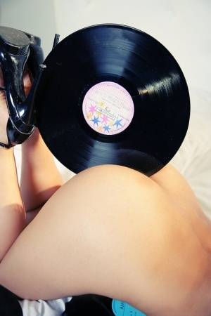 Glamour teen Ruth Medina gets naked and kink with her old record collection on realgirlsweb.com