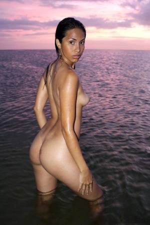 Latina model Ruth Medina poses nude for a solo shoot at the beach on realgirlsweb.com